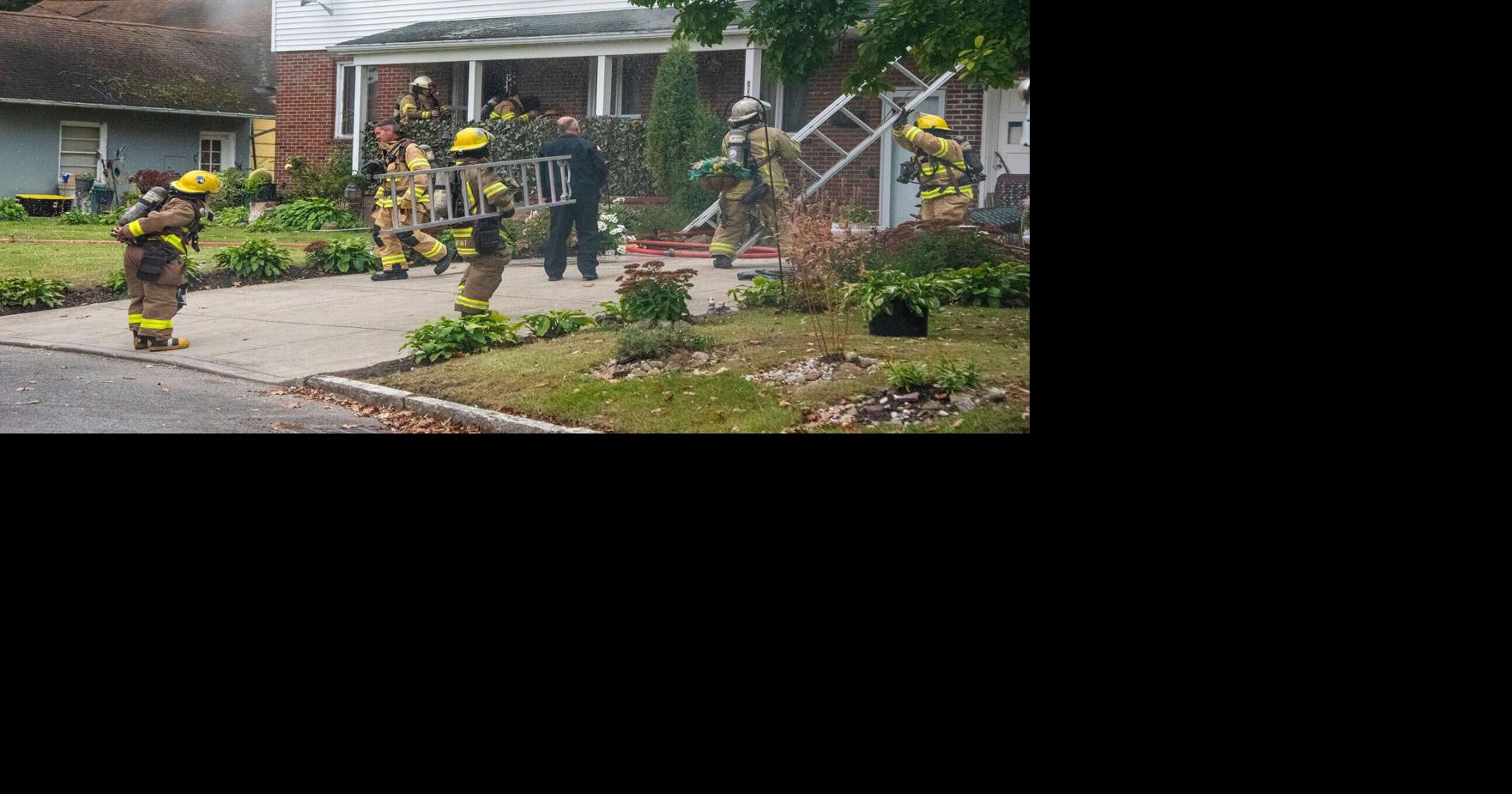 Niagara Falls police officer rescues woman, dog from burning house ...