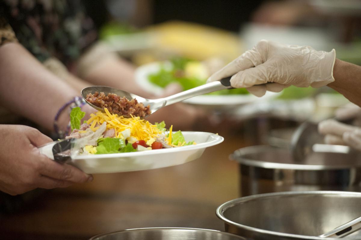 Nursing home residents make meals for needy News