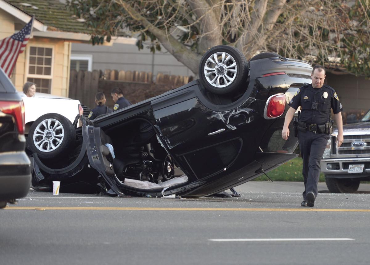 Woman arrested after her car hits parked truck in Lodi News