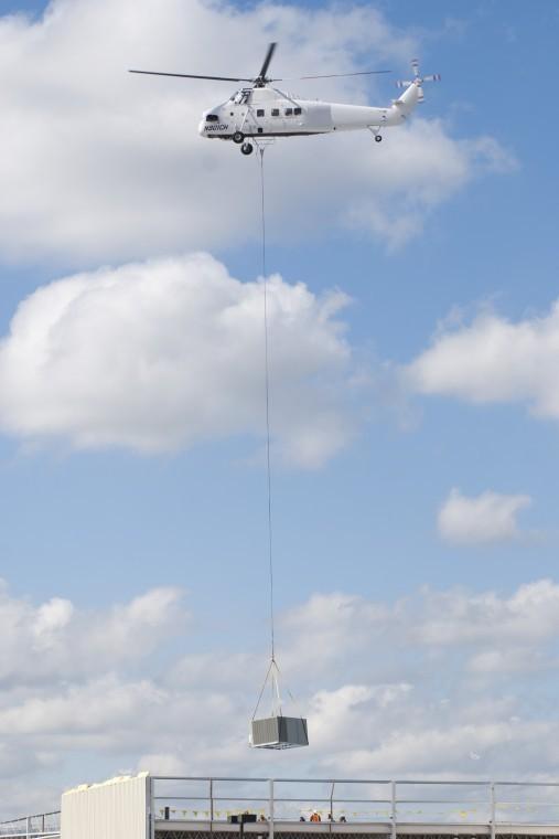 Helicopter places airconditioning units on roof of Costco Lodinews