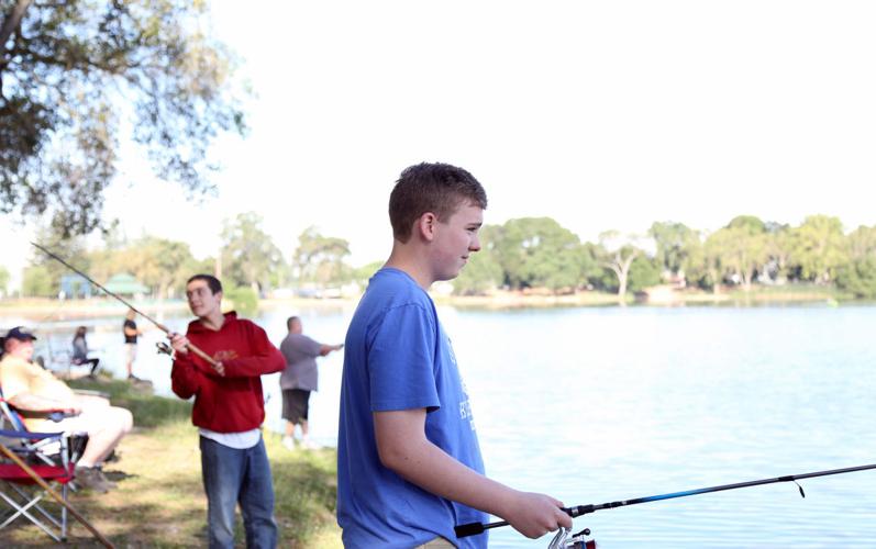 Hooked on fishing: Children reel in big trout at Youth Fishing Derby, News