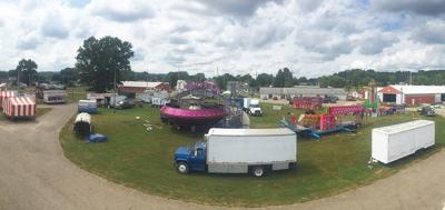 fair hocking county setting logandaily crews putting booths fairgrounds rides activity together friday were