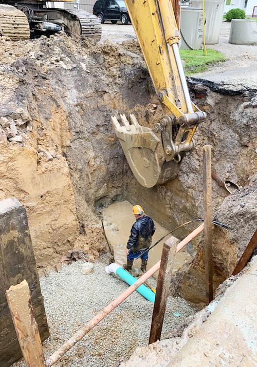 Unsafe manhole being dug