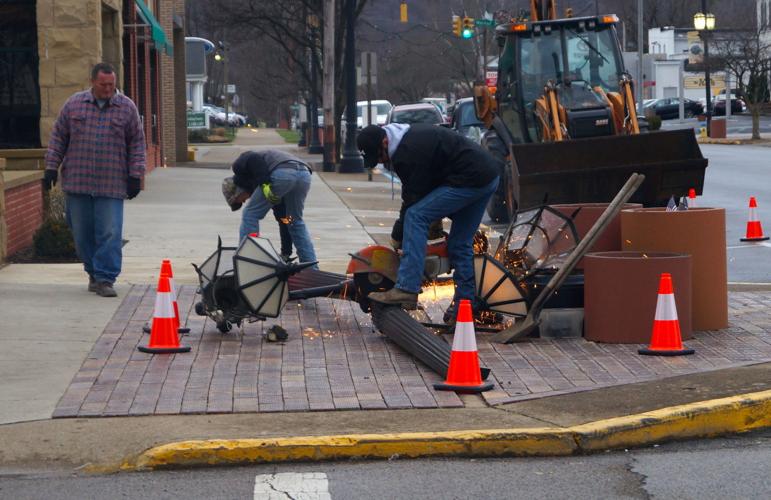 Light pole knocked down on corner of Main and Mulberry streets News