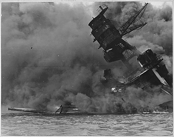 The USS ARIZONA burning after the Japanese attack on Pearl Harbor