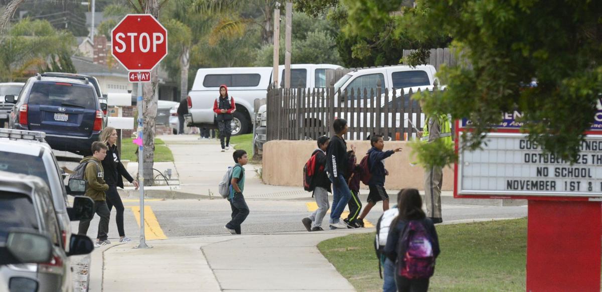 Students walk to Alice Shaw Elementary School in October 2018