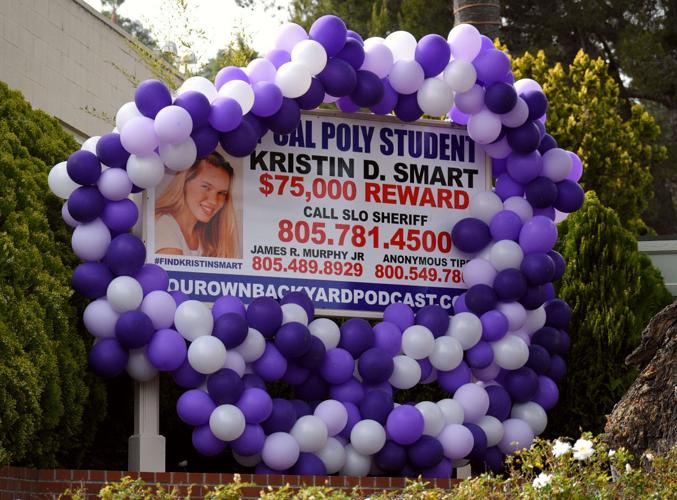 Balloons wrap around the billboard of Kristin Smart in Arroyo Grande after the arrest of Paul and Ruben Flores Tuesday.