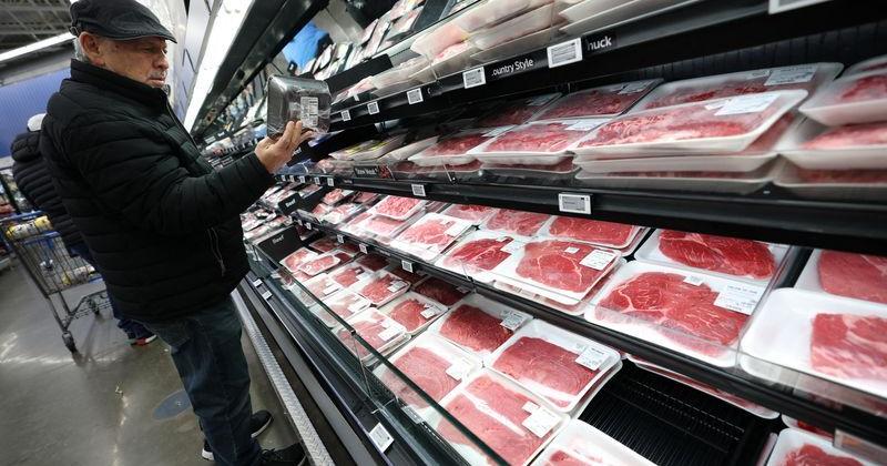 Customer shops for beef at Walmart Supercenter retail store in North Bergen, New Jersey