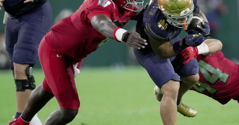 Wisconsin linebacker Justus Boone (0) tackles Notre Dame running back Nolan James Jr. (2) during the third quarter of their game