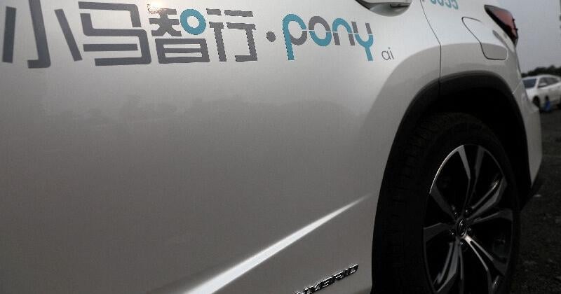 FILE PHOTO: Logo of Pony.ai is seen on a Lexus vehicle equipped with the company's autonomous driving system, in Beijing