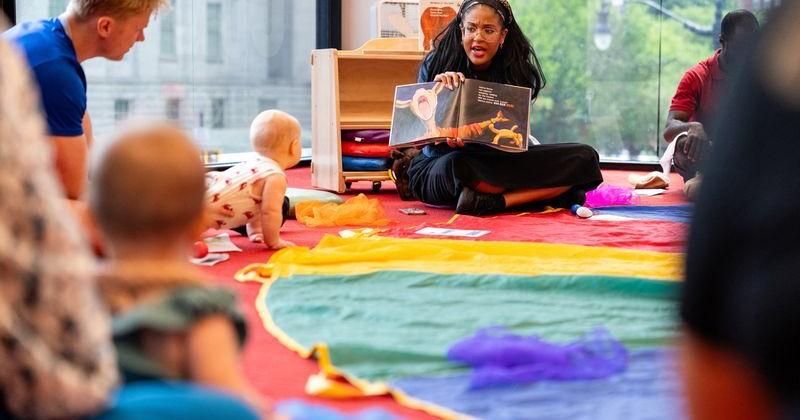 Librarian reads a book from Dolly Parton's Imagination Library at Martin Luther King Jr. Memorial Library in Washington