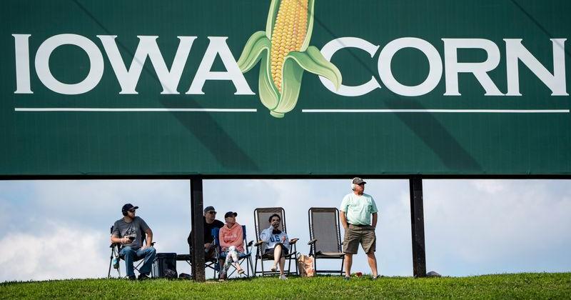 Fans stand and watch from the backstretch during the NASCAR Cup Series Iowa Corn 350 on Aug. 3, 2025, at Iowa Speedway in