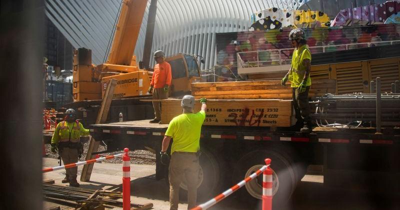 Workers carry out construction work amid high temperatures in Lower Manhattan, New York