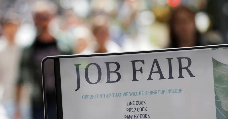 Signage for a job fair is seen on 5th Avenue after the release of the jobs report in Manhattan, New York City