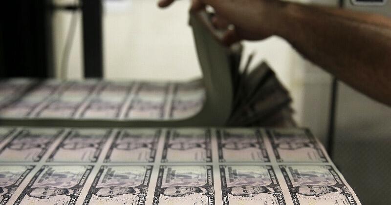 Sheets of Lincoln five dollar bill are seen at the Bureau of Engraving and Printing in Washington