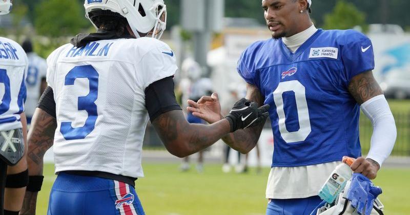 Bills wide receiver Keon Coleman greets defensive back Damar Hamlin during day six of Buffalo Bills training camp at St. John Fisher University Thursday, August 5, 2026 in Pittsford.