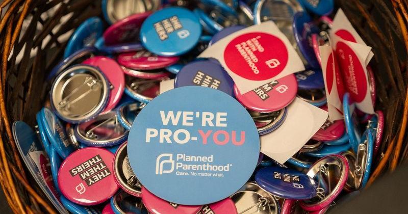 Buttons sit free for the taking Monday, Aug. 17, 2026, inside Planned Parenthood’s Indianapolis location on Georgetown Road.