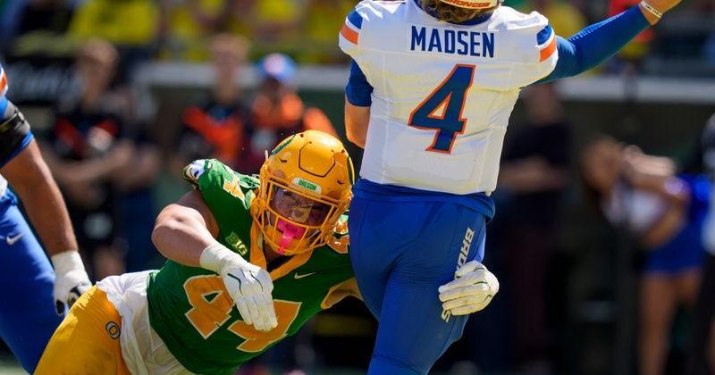Oregon outside linebacker Teitum Tuioti pressures Boise State quarterback Maddux Madsen as the Oregon Ducks host the Boise State Broncos on Sept. 5, 2026, at Autzen Stadium in Eugene, Oregon.
