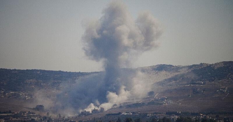 Smoke rises in southern Lebanon following an Israeli strike, as seen from Zawtar al-Gharbiyeh