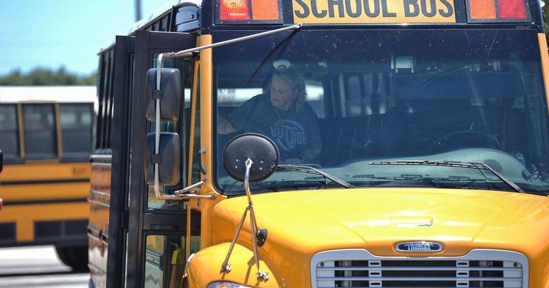 Martin County school bus driver Evonne Eicher checks her bus before heading out from the bus compound on Aug. 15, 2025, in Stuart. Eicher was named Florida School Bus Driver of the Year for 2025.