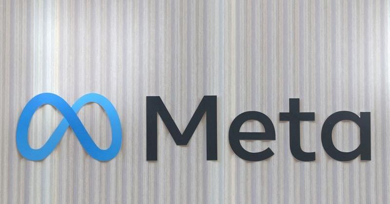 FILE PHOTO: The logo of Meta is seen at the entrance of the company's temporary stand ahead of WEF in Davos