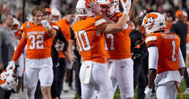 Oklahoma State Cowboys quarterback Drew Mestemaker (17) and wide receiver Wyatt Young (10) celebrate after a touchdown during a