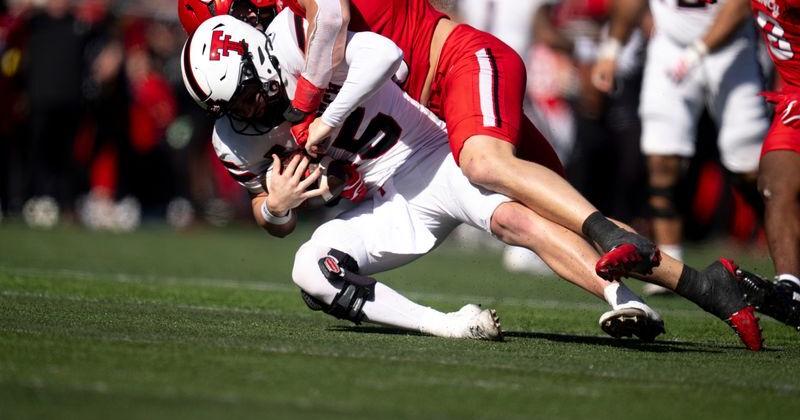 Cincinnati Bearcats edge rusher Patrick Bauer (10) sacks Texas Tech Red Raiders quarterback Will Hammond (15) in the third quarter of the Big 12 game between Cincinnati Bearcats and Texas Tech at Nippert Stadium in Cincinnati on Saturday, October 24, 2026.