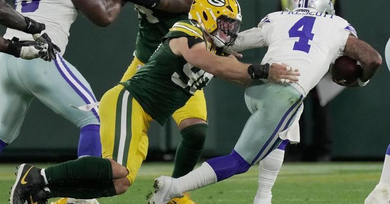 Green Bay Packers defensive end Lukas van Ness (90) sacks Dallas Cowboys quarterback Dak Prescott (4) during the fourth quarter of their game Sunday, Oct. 18, 2026 at Lambeau Field in Green Bay, Wisconsin.
