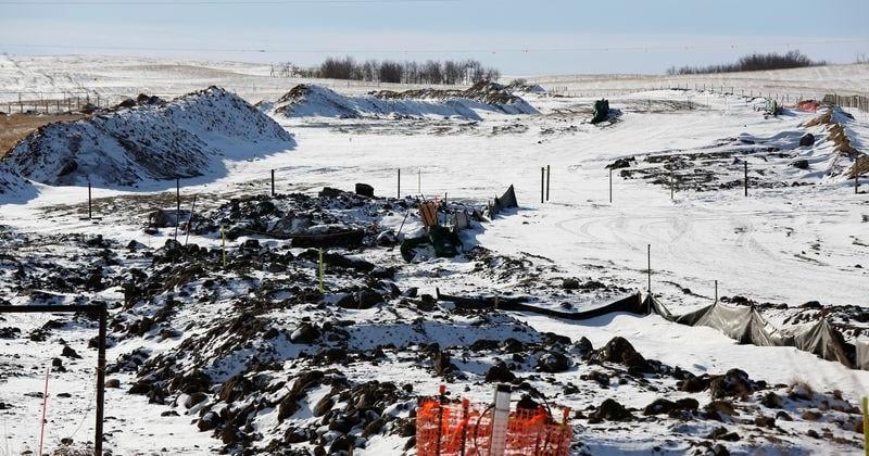 The route of the Keystone XL crude oil pipeline lies idle through a farmer's field near Oyen