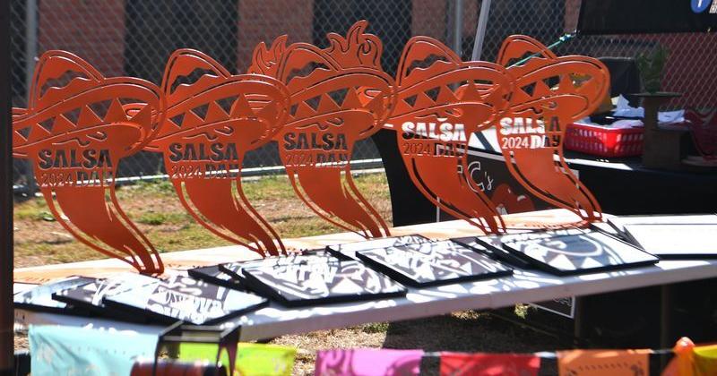 Pepper-shaped trophies wait to be handed out during the Wichita Falls Farmers Market Salsa Day Showdown on Aug. 17, 2024.