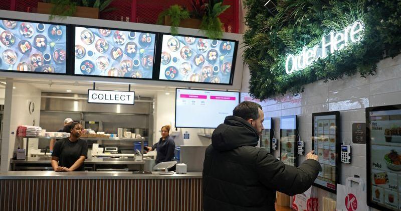 Customer uses electronic ordering station at a K10 Japanese restaurant in London