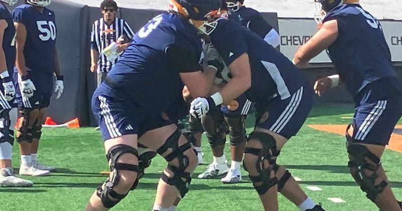 UTEP right tackle Tyler Roberts (left) goes through a drill Wednesday at the Sun Bowl