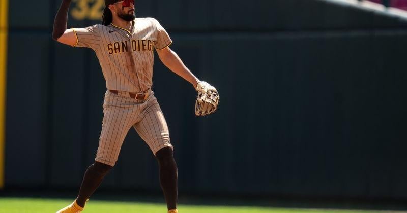 San Diego Padres second baseman Fernando Tatis Jr. (23) throws to first for an out in the seventh inning of the MLB game between