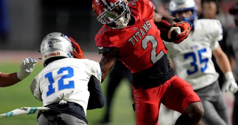 Carl Albert's Jacson Webster is pushed out by Guthrie's Dereon Whitehorn during a high school football game between Carl Albert and Guthrie in Midwest City, Okla., Friday, Oct. 31, 2025.