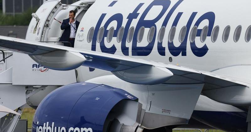 Branding for JetBlue Airlines is seen at Farnborough International Airshow, in Farnborough