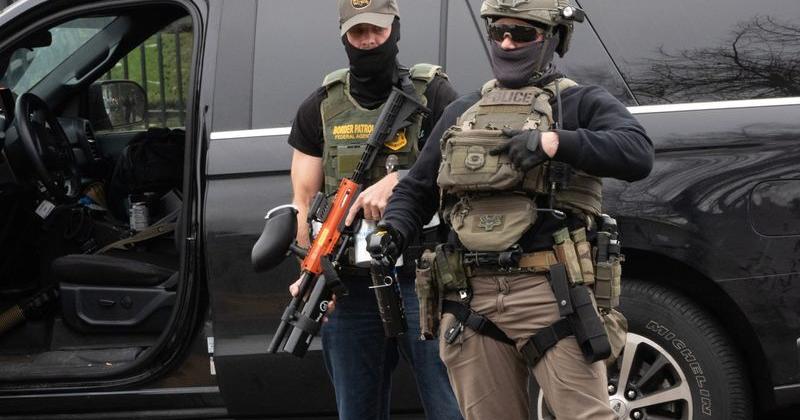 An Immigration and Customs Enforcement agent points to his badge during a traffic stop in Springfield, Oregon, on Nov.19, 2025.