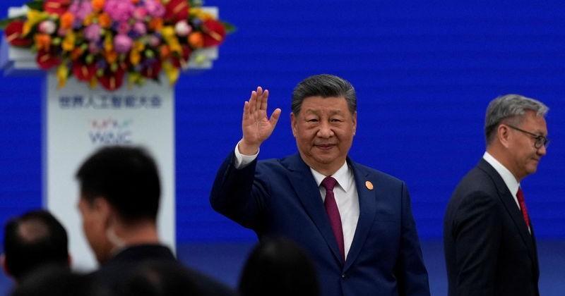 Chinese President Xi Jinping waves as he arrives at the opening ceremony for the World AI Conference in Shanghai