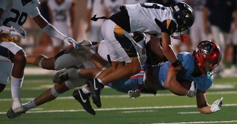 Socorro High School running back Adrian Hunt (21) stretches for a first down during the Bulldogs’ game at the Socorro ISD Student Activities Complex in El Paso, Texas, Thursday, Sept. 25, 2025.