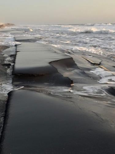 Sections of destroyed pavement are seen along the Outer Banks in North ...