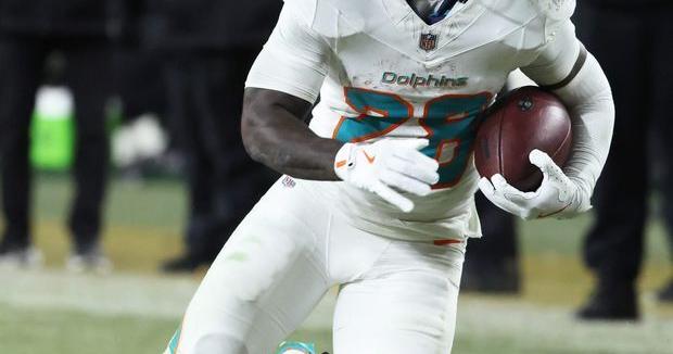 Dec 15, 2025; Pittsburgh, Pennsylvania, USA; Miami Dolphins running back De'Von Achane (28) moves with the ball in the fourth quarter against the Pittsburgh Steelers at Acrisure Stadium. Mandatory Credit: Charles LeClaire-Imagn Images