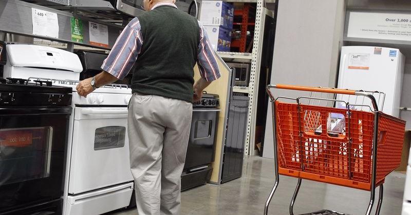 A man shops for an oven at a Home Depot store in New York