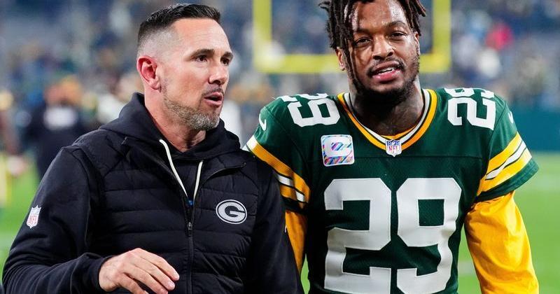 Green Bay Packers head coach Matt LaFleur and safety Xavier McKinney (29) walk off the field after defeating the Dallas Cowboys