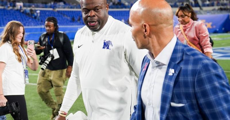Memphis' head coach Charles Huff talks to athletic director Ed Scott after Memphis defeated ECU 41-34 in overtime at Simmons Bank Liberty Stadium in Memphis, Tenn., on October 22, 2026.