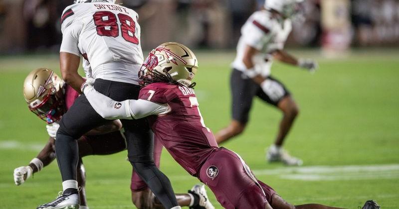 Florida State Seminoles defensive back Ashlynd Barker (7) tackles New Mexico State Aggies tight end Carson Su'esu'e (88). The Florida State Seminoles defeated the New Mexico State Aggies 34-17 at Doak Campbell Stadium on Saturday, Aug. 29, 2026.