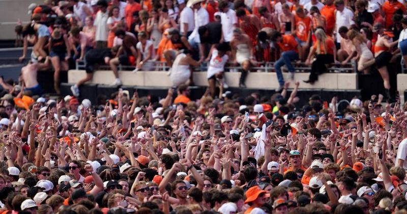 Fans storm the field following the college football game between the Oklahoma State Cowboys and the Oregon Ducks at Boone Pickens Stadium on Sept. 2, 2026.