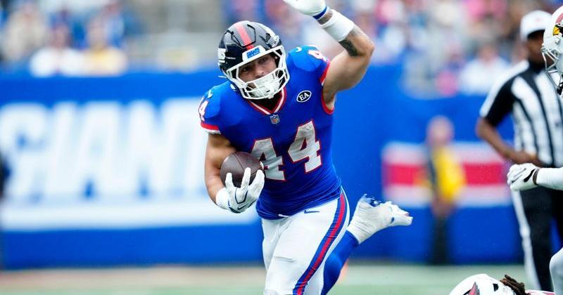 New York Giants running back Cam Skattebo (44) loses his balance but continues running with the ball, Sunday, Oct. 4, 2026, in East Rutherford.