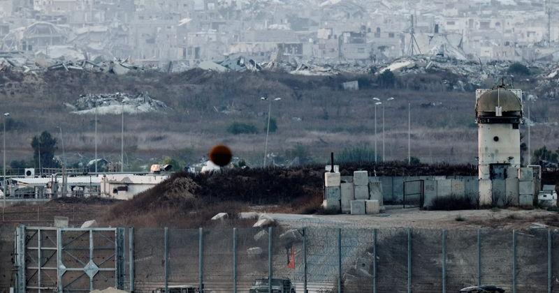 Military vehicles operate on the border with Gaza