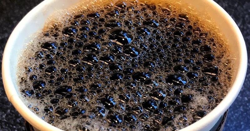 A cup of coffee is pictured on a table in the Manhattan borough of New York City