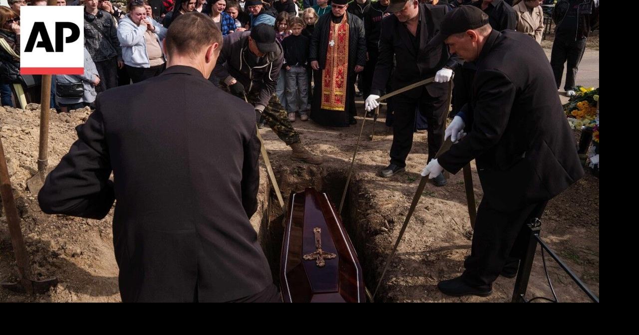 Mourners gather for funeral of eight-year-old boy killed in Russia ...