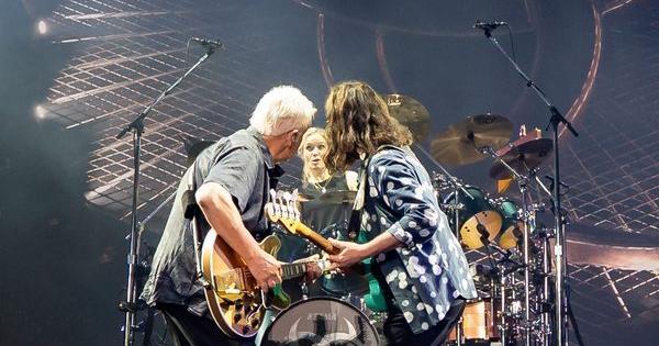 Rush guitarist Alex Lifeson (left), new drummer Anika Nilles and bassist/singer Geddy Lee share a moment during the band's June 7, 2026 return at the Kia Forum in Los Angeles.